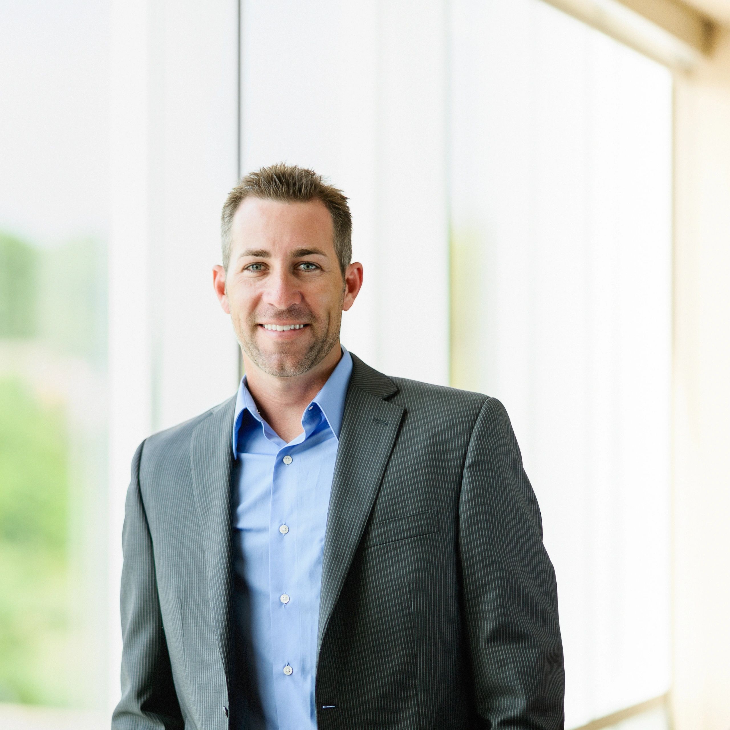 Professional headshot of a male financial advisor