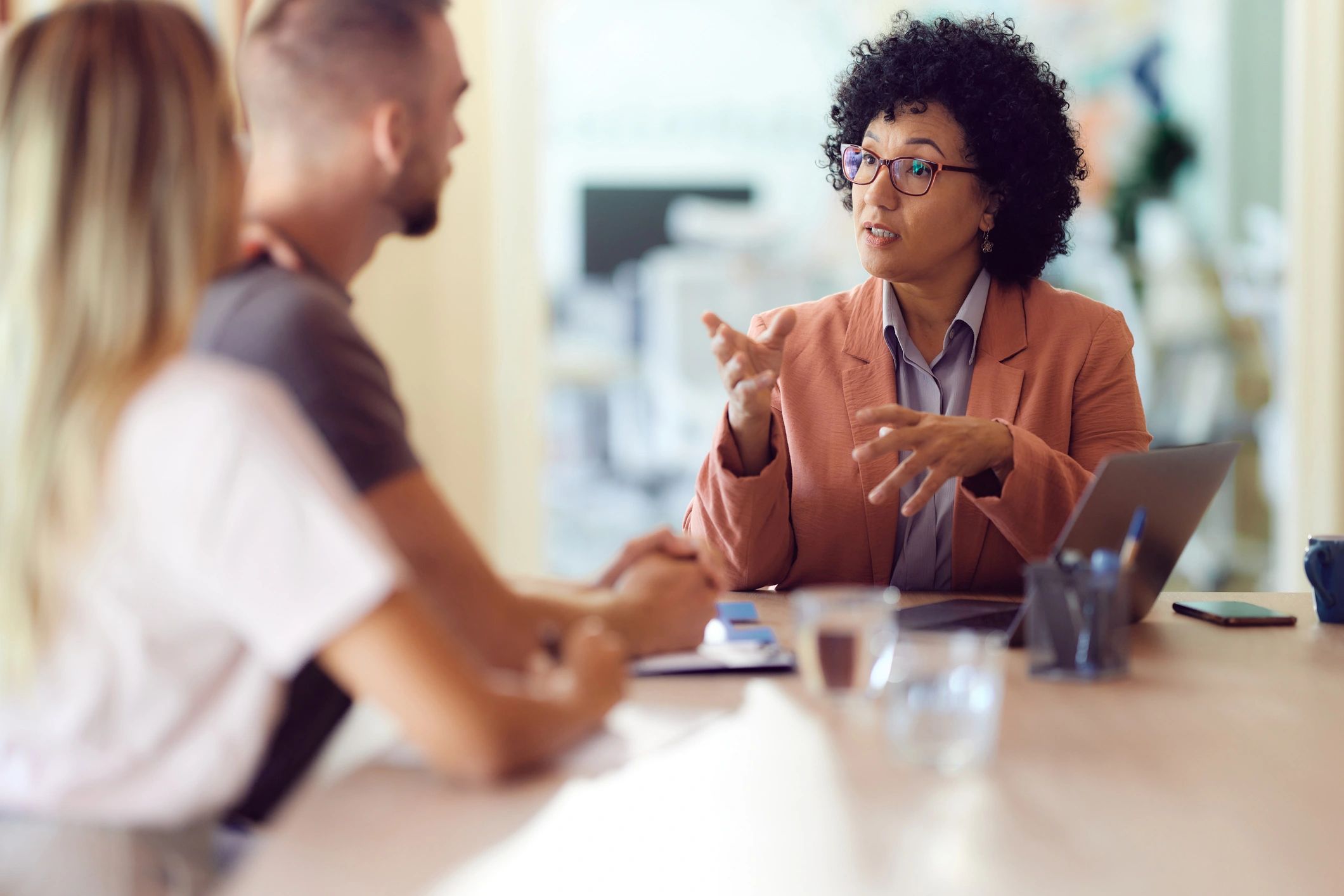 Financial advisor meeting with clients in an office