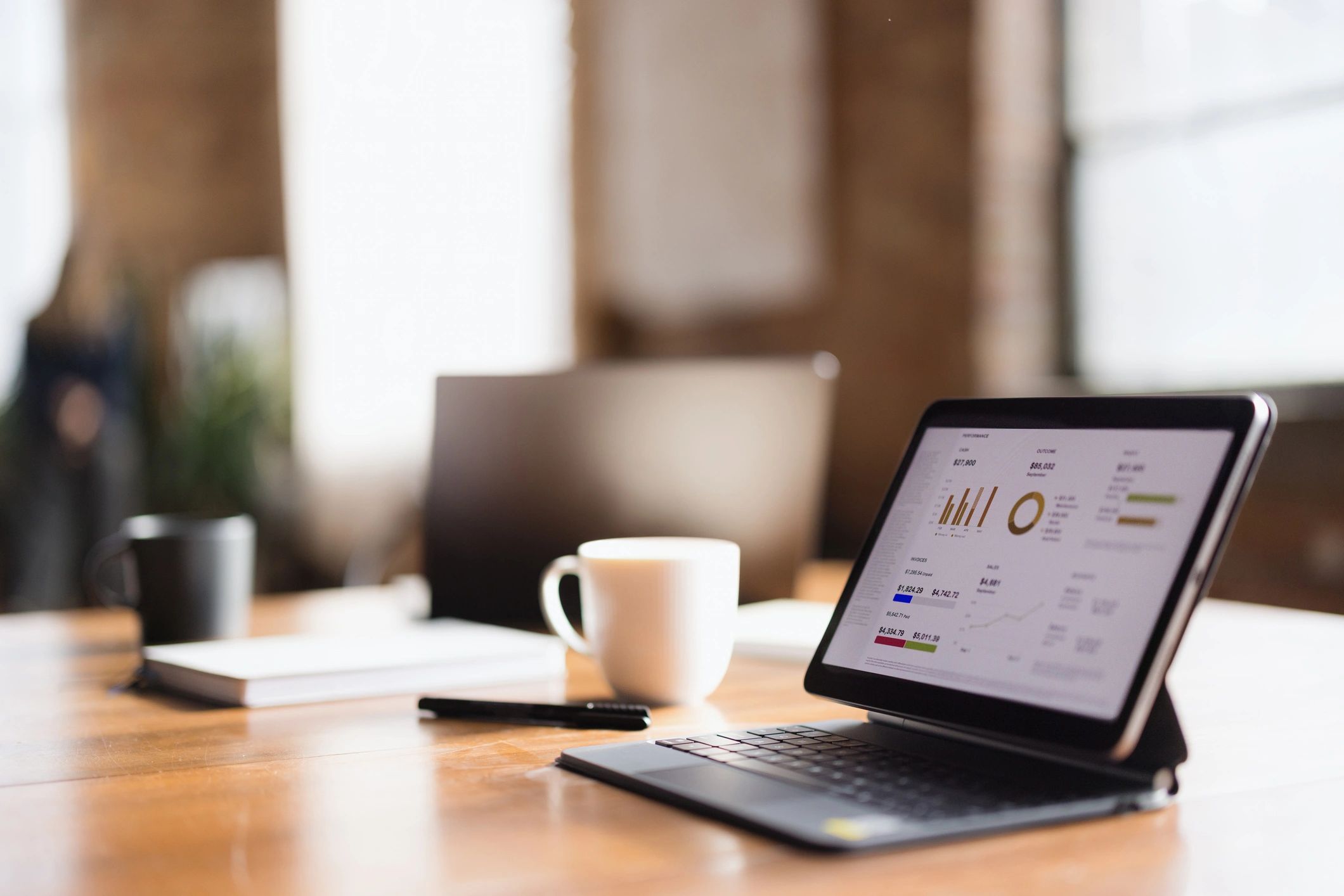 Tablet displaying investment chart on a desk