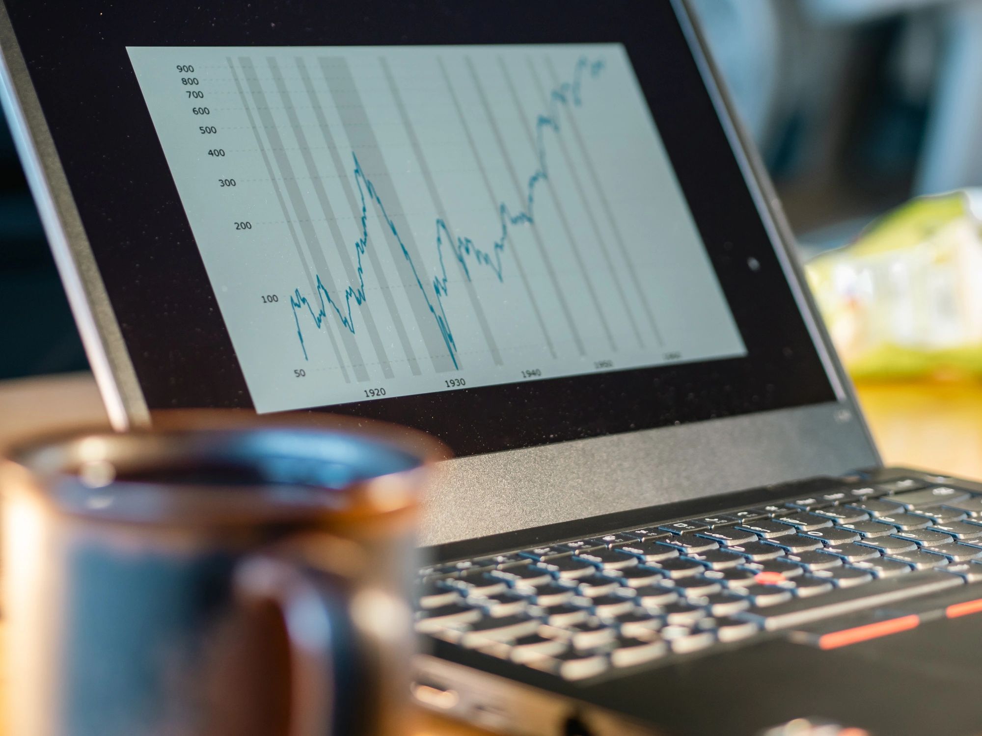 Laptop showing a rising financial chart